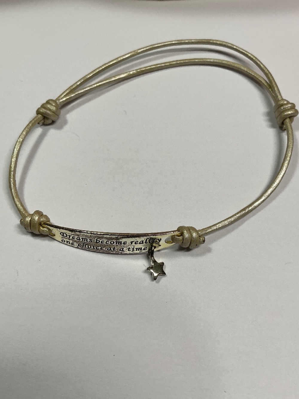 Sterling Silver dreams become reality, one choice at a time is inscribed. 7”